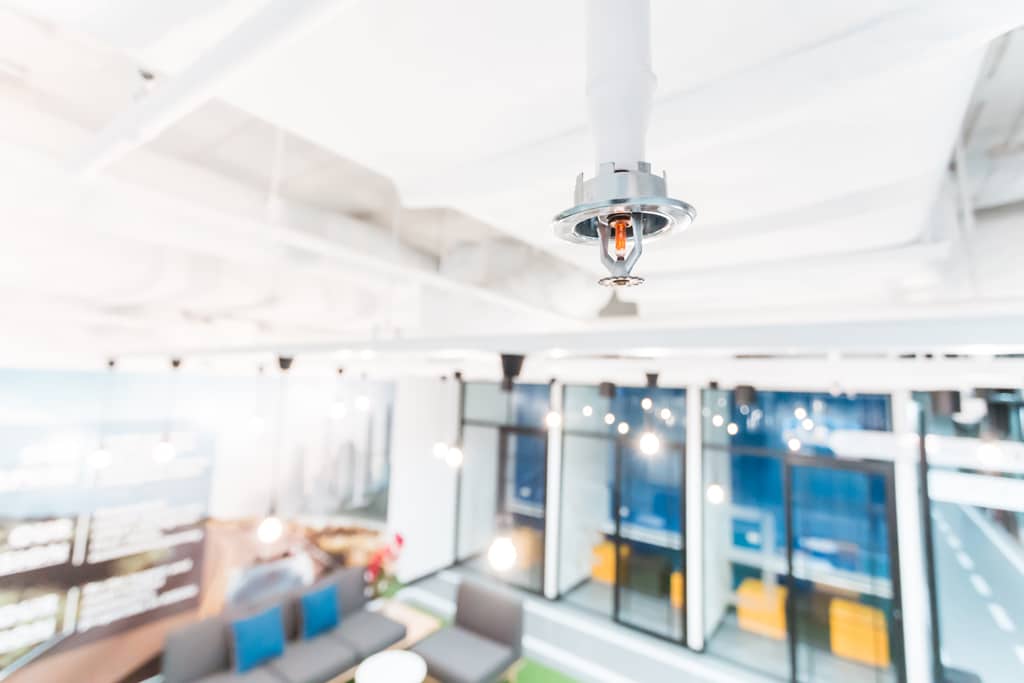 Fire Sprinkler in office building blur background., focus at sel